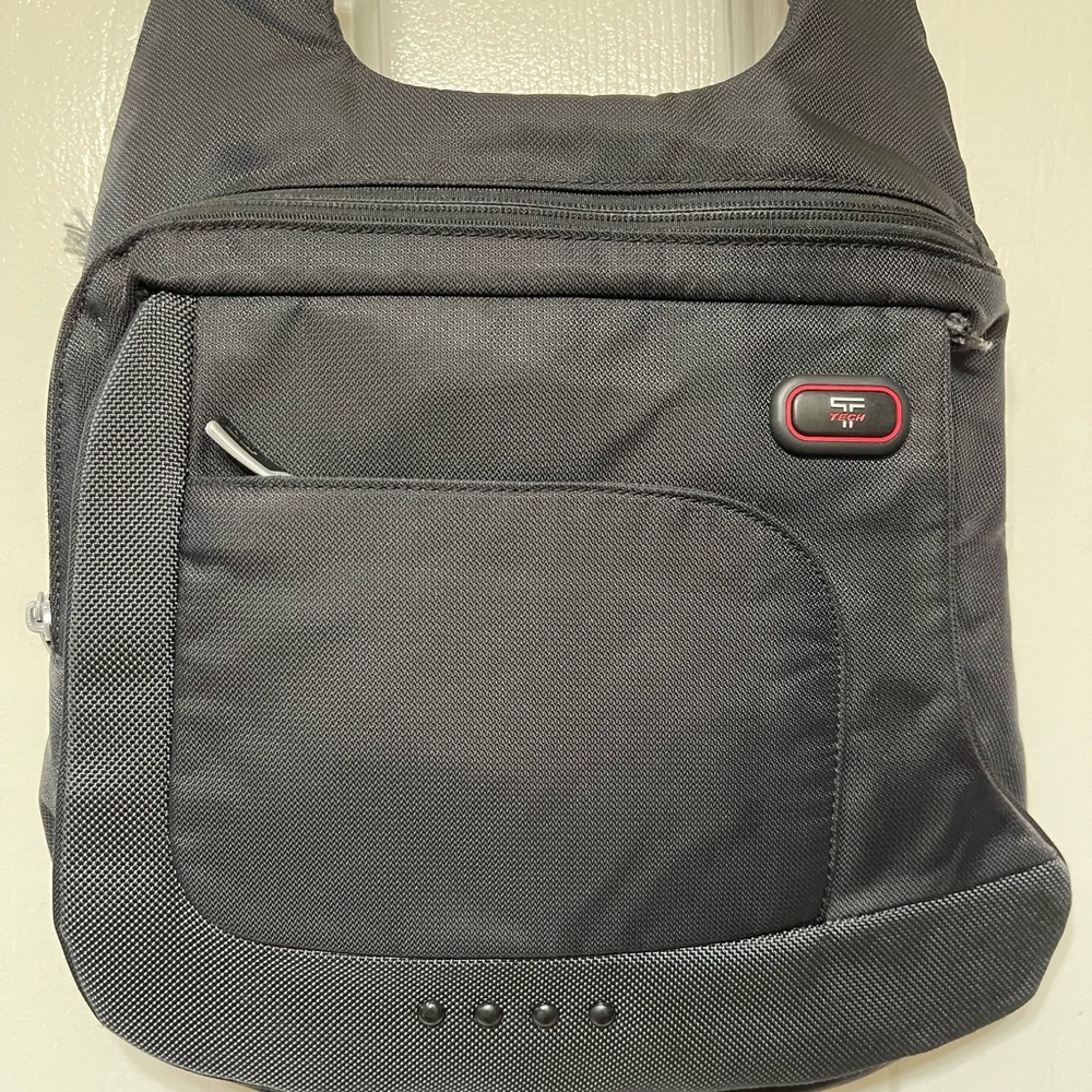 Tumi crossbody tech bag